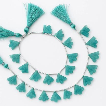 Strand of carved teal gemstone fan beads with tassels for jewelry making