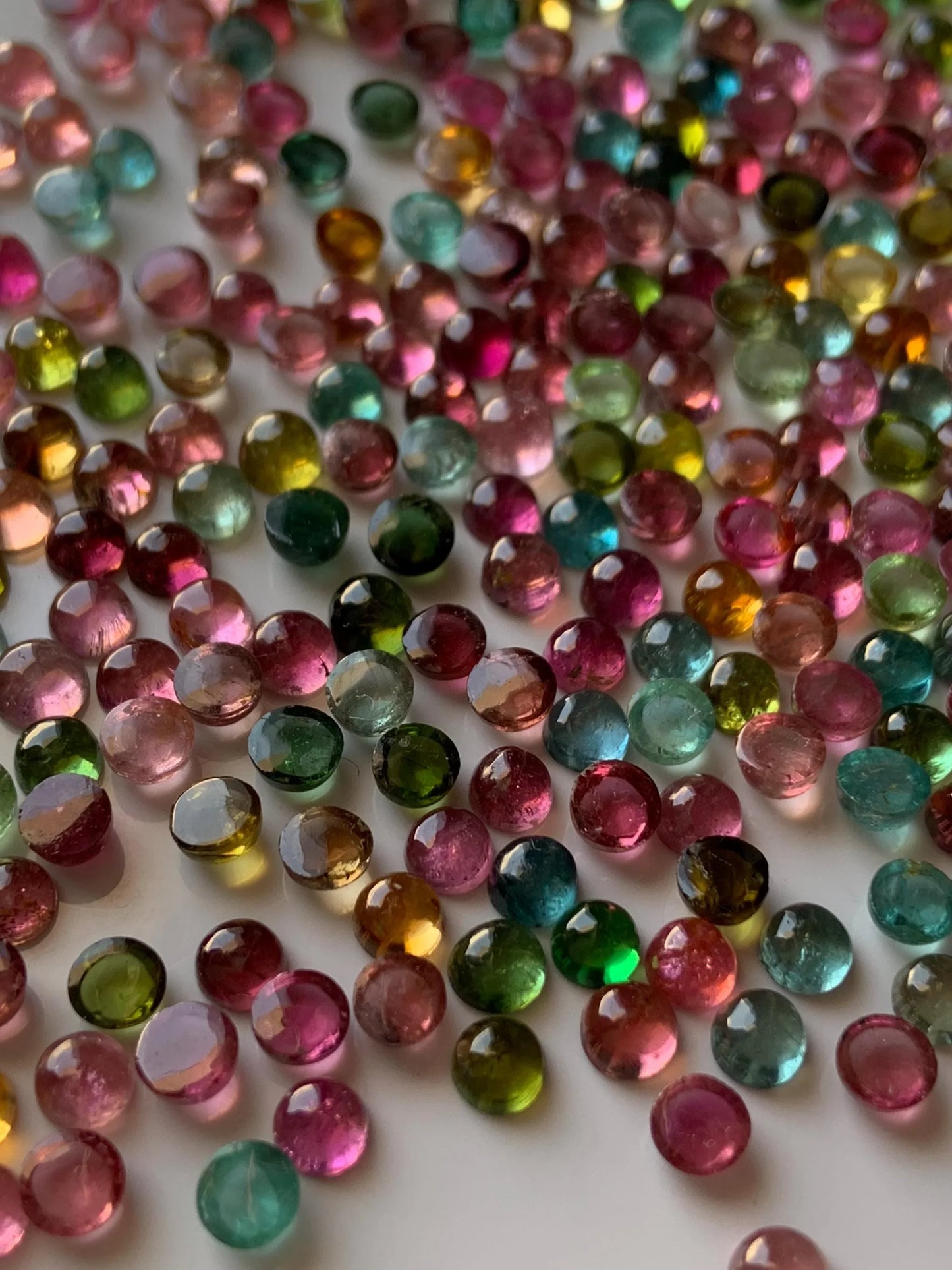 Mixed color round natural gemstone cabochons for jewelry making on white background