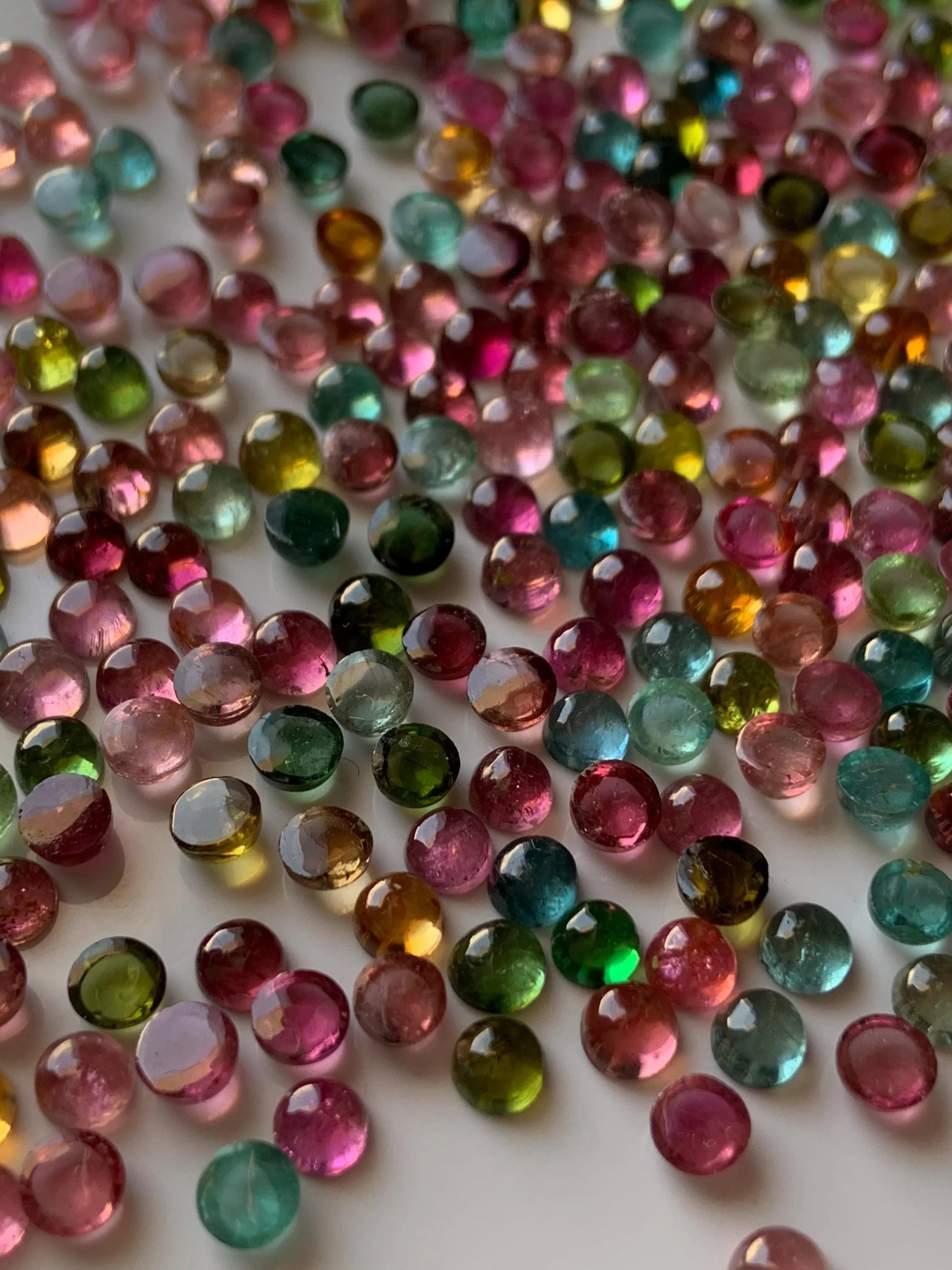 Mixed color round natural gemstone cabochons for jewelry making on white background