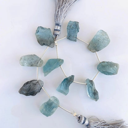 Raw aquamarine gemstone beads on string with silver tassels, natural crystal jewelry supplies