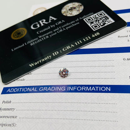 Round cut gemstone with grading certificate and warranty card