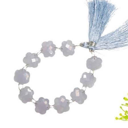 Faceted flower-shaped blue chalcedony gemstone beads strung with a light blue tassel.